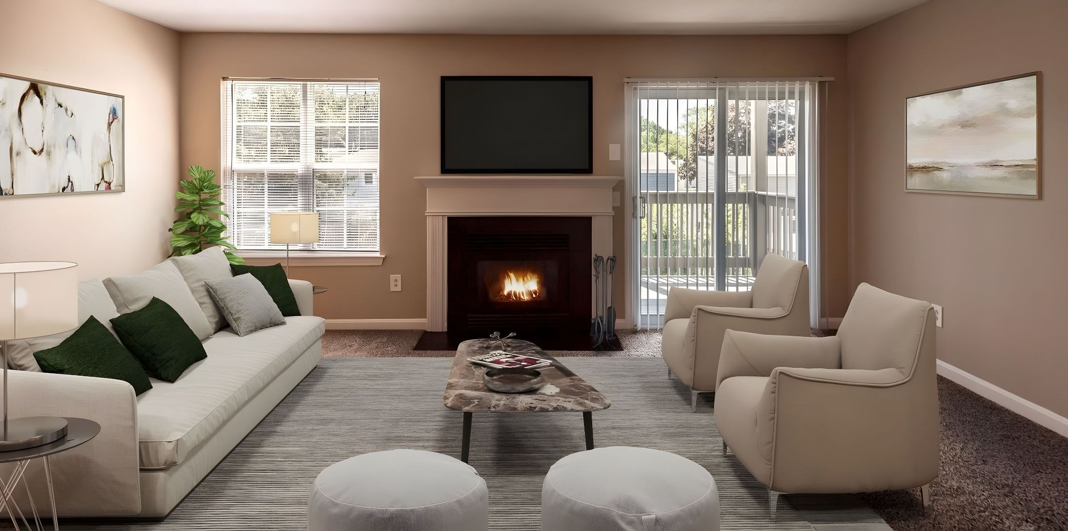 Windshire Terrace Apartments Living room with a fireplace, television, sofa, two armchairs, and a coffee table on a gray rug.
